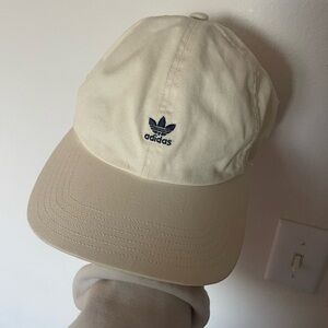Beige and navy blue woman’s adidas cap